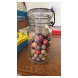 Jar with a collection of   Clay marble  ??