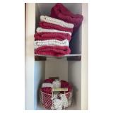 Bathroom towels and washcloths in metal basket