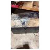 Metal box with what looks like concrete tools