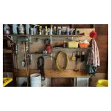 Wall of Items Fuel Can, Air Hose, Buckets,