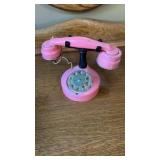 Vintage pink rotary desk telephone with cradle