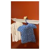 Vintage baby dresses and white shelf
