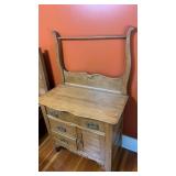 Beautiful solid wood washstand on casters.