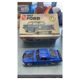 1 Diecast model car and one plastic model car
