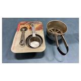 Measuring cups and flower sifter