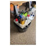 Plastic tub with half bottles of chemical and oil