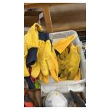 Box of gloves mostly all yellow work gloves And