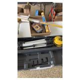 Group of tools.  Level with Tripod, Rods, & more