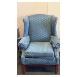 Traditional blue wingback armchair upholstered in