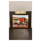 Repop Lionel Tin Sign on thick black cardboard