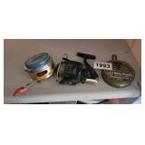 2 FISHING REELS AND SINKERS
