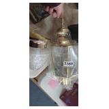 (2) LIGHT FIXTURES, (1 IS NEW IN PLASTIC)