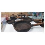 LOT OF CAST IRON COOKWARE WITH WOOD HANDLES