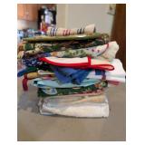 STACK OF KITCHEN TOWELS AND POT HOLDERS