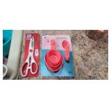 MEASURING CUPS AND SPOONS AND SCISSORS
