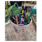 BASKET FULL OF WRITTING INSTRUMENTS