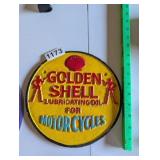 GOLDEN SHELL CAST IRON ADVERTISEMENT