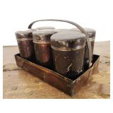 6 small tins in carrier