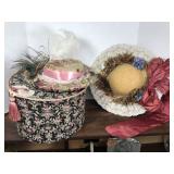 Two fancy hats and hat box