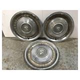 Set of three vintage Cadillac hub caps