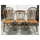 Three wood dining chairs