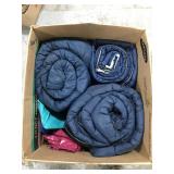 Three sleeping bags and ponchos