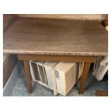 Wooden table with metal covered top