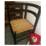 Round back chair and 2 raggedy Ann dolls