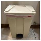 2 trash cans and toilet paper holders