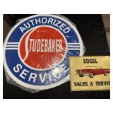 2 metal automotive signs