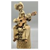 Rex Benson Sitting Cowboy Playing a Guitar