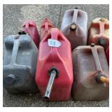 8 various sized gas cans