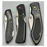Assortment of Black Folding Pocket Knives