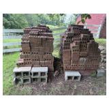 2 large stacks of brick and concrete blocks