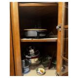 Cabinet Full of Dishes, slow cooker, bags