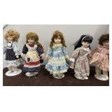 5 vintage porcelain dolls with stands