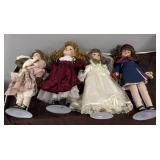 4 vintage porcelain dolls with stands