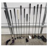 Assorted drivers, woods, hybrids, and putter