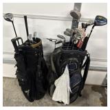 2 golf bags and assortment of clubs