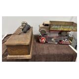 Antique telephone and toy trucks
