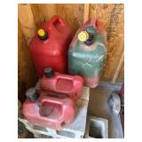 4 gas cans and 2 cycle oil mix