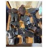 Box of miscellaneous holsters and mag pouches