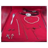 Assorted jewelry, bolo ties, and letter opener