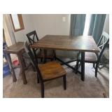 Kitchen table with three chairs and one stool
