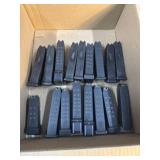 Assortment of Glock magazines and parts