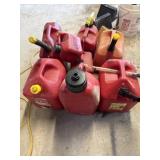 8 assorted gas cans