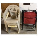 9 plastic chairs and 2 metal framed folding chairs