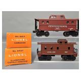 Two Mint Lionel Postwar O Cabooses in Original Boxes