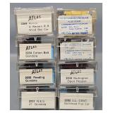 Eight Atlas N Scale Freight Cars in Clear Cases