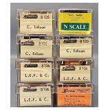 Eight N Scale Hoppers in Clear Cases